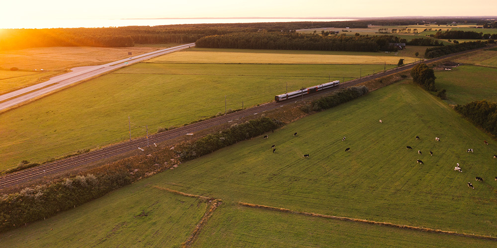 Train moving through fields.